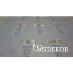 Esküvői ültetési rend szalaggal díszítve 